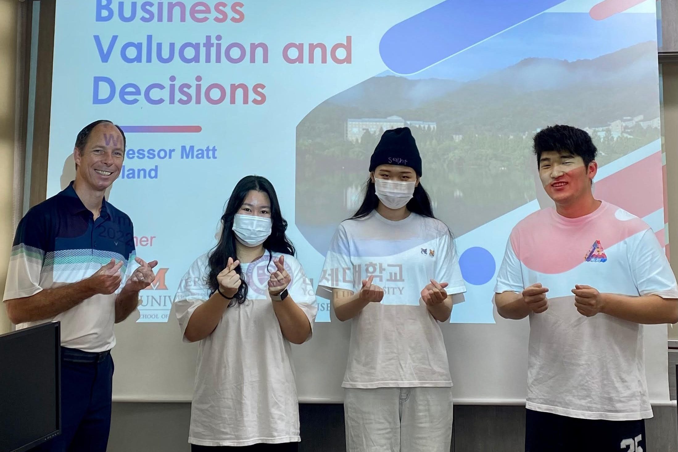 Weiland poses with Korean Students at a lecture