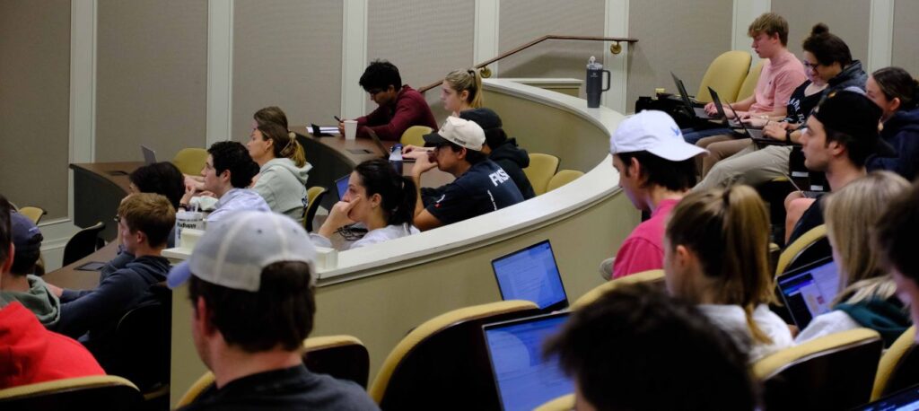 Photo shows students in the auditorium listening to the speaker