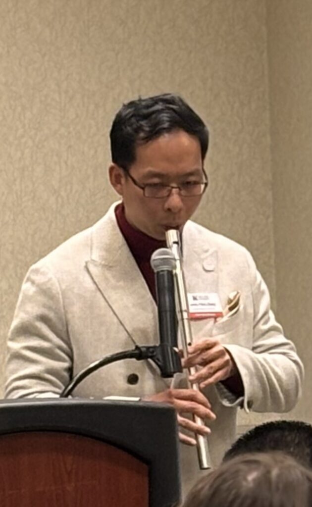 James Zhang playing an Irish whistle