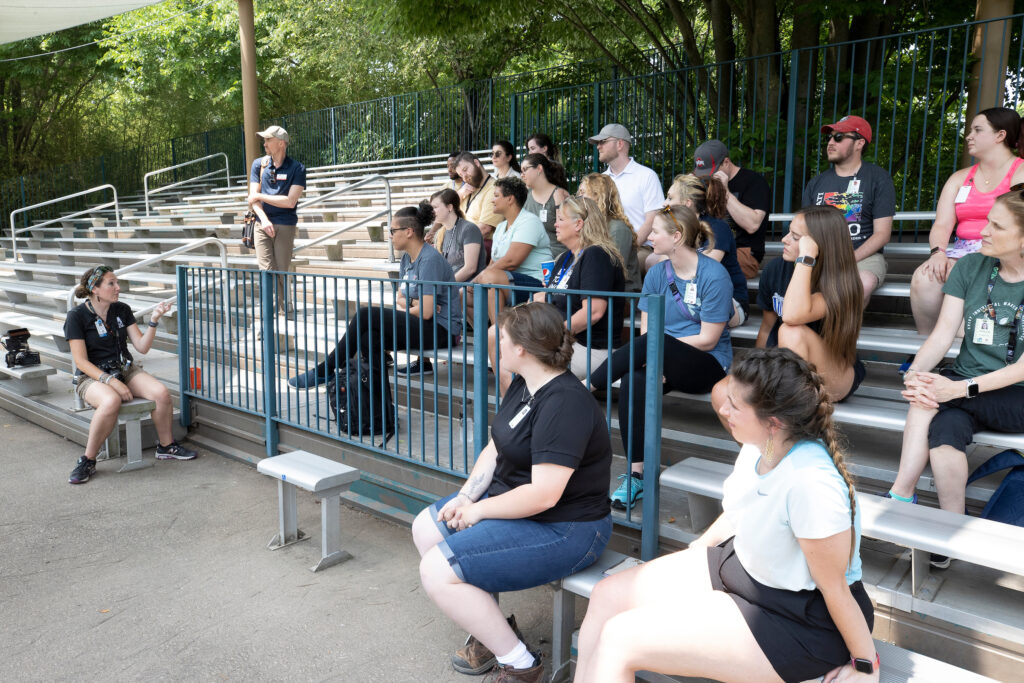 Students at CZBG learning. Many students sitting in bleachers