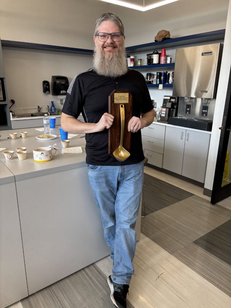 Patrick Hawk displaying his golden first place ladle