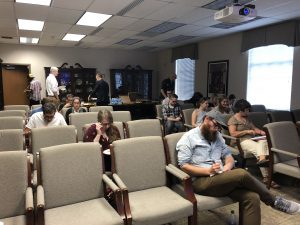 Students and faculty gather to learn more about archival research.