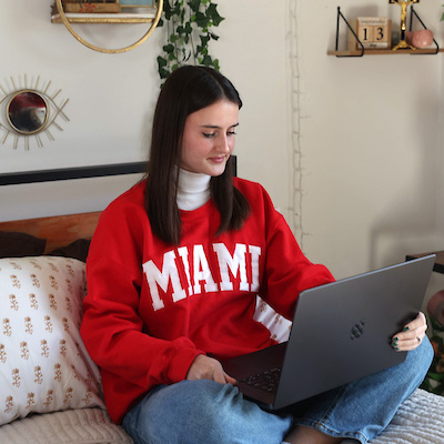 An online Miami student studying learning from home.