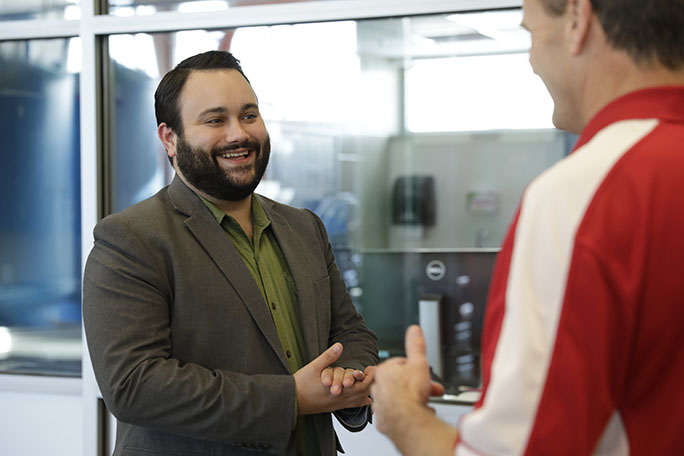 Adam Sizemore talking to a man