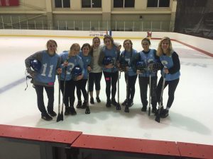 broomball players posing together
