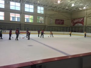 students playing broomball 
