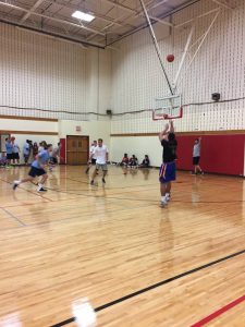 students playing basketball