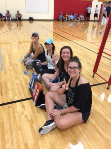 volleyball students sitting and posing together