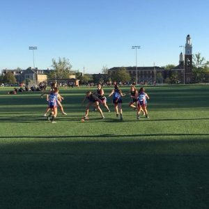 students playing football