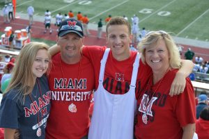 A family wearing Miami merch