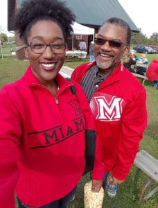 People wearing Miami merch taking a selfie