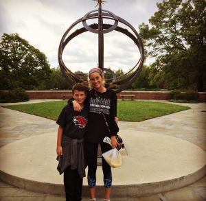 Young people posing in front of the Sun Dial