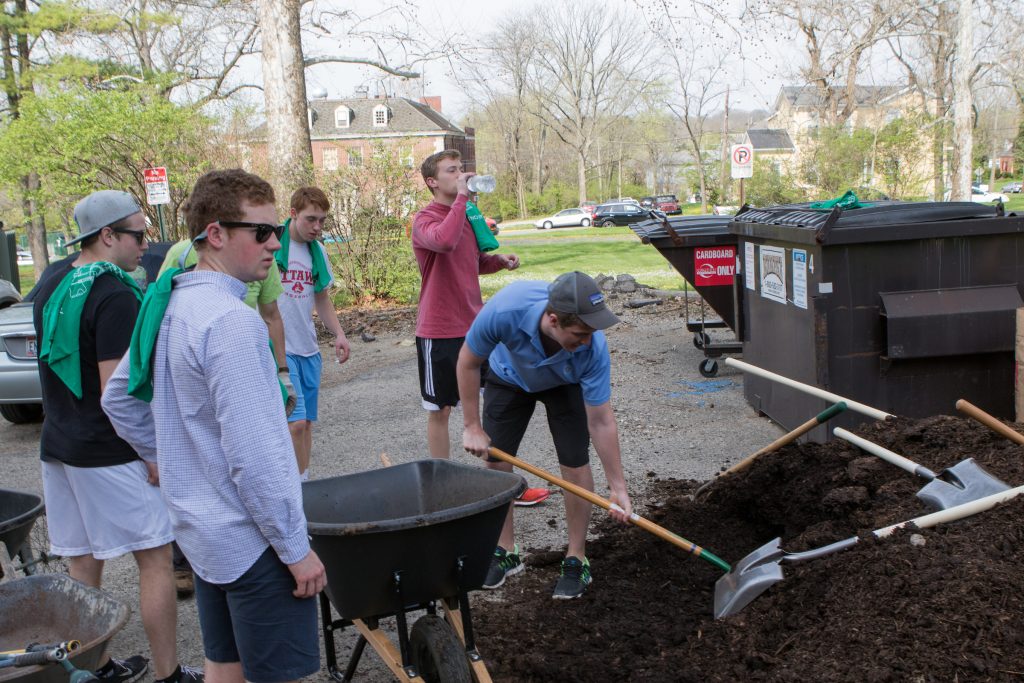 Students working in a garden at Oxford Community Arts Center