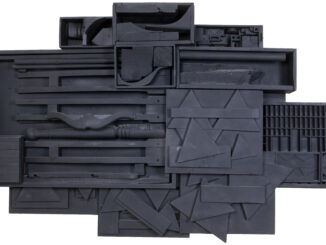 Abstract sculpture made from pieces of furniture and found wooden items painted black