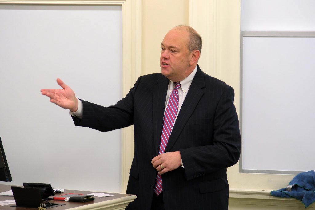 Bill Moser Speaking in Front of Class