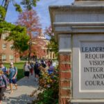 Pillar next to walkway to Farmer School of Business States Leadership requires vision, integrity, and courage