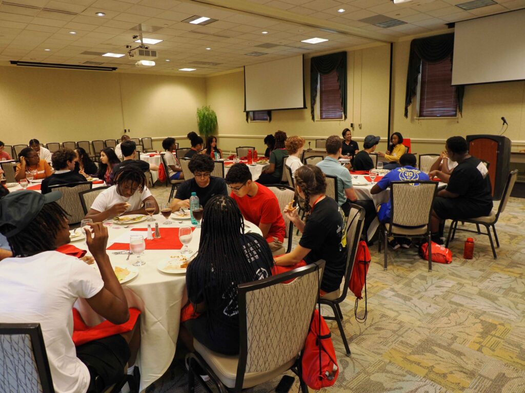 students seated at round tables