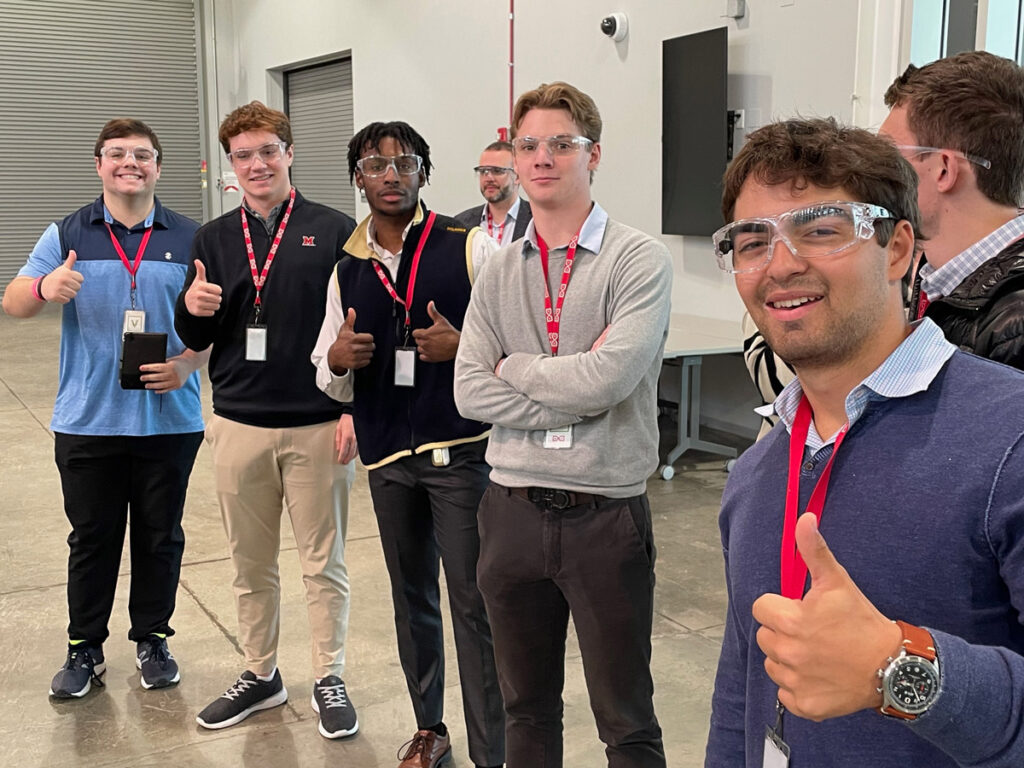 A group of students giving the thumbs-up sign