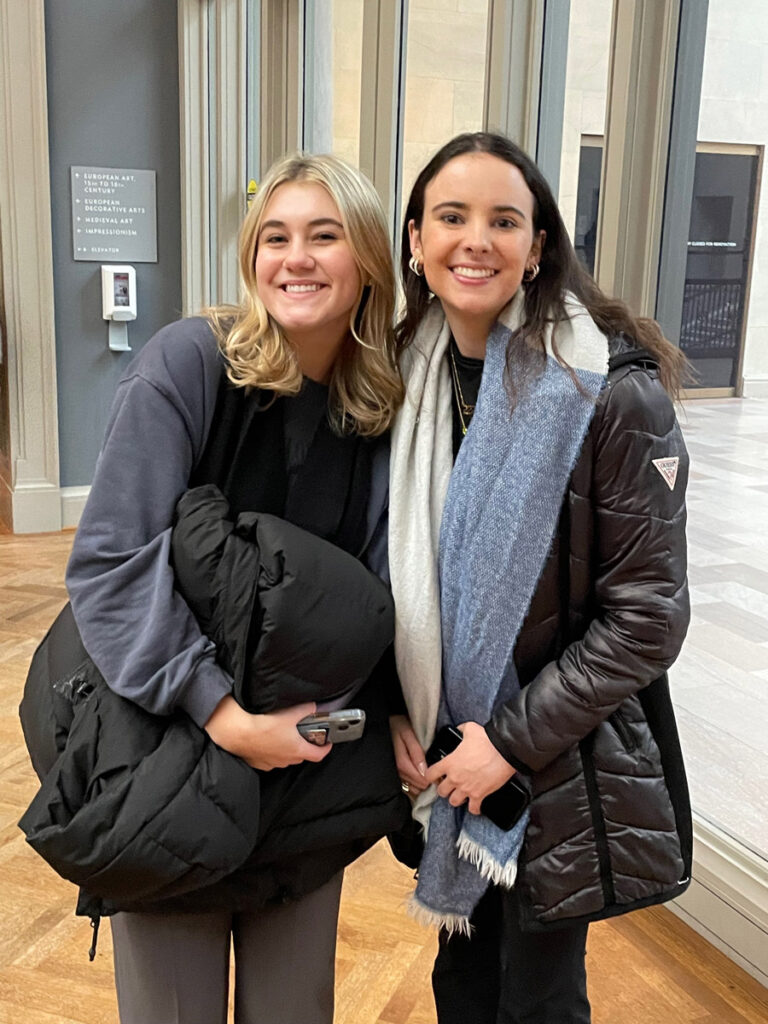 Two young women pose for a photo