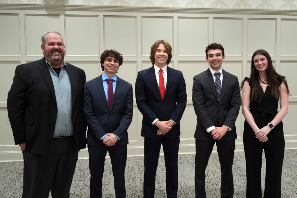 Group photo with Accountancy professor Jon Grenier and the second-place winners