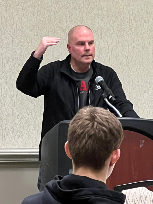 David Woolworth speaks at a podium