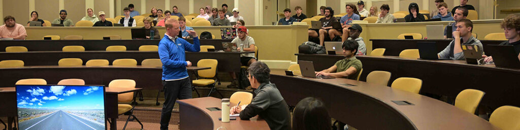 Students listen to Dan Perschke speak