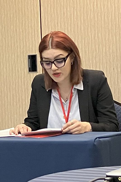 Anastasija as a panel speaker at a conference