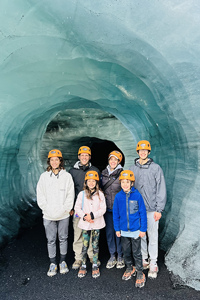 Bob Guido's family of six posing inside an ice cave
