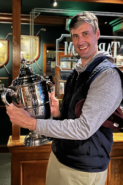 Phil Landes holding up a Wanamaker Trophy