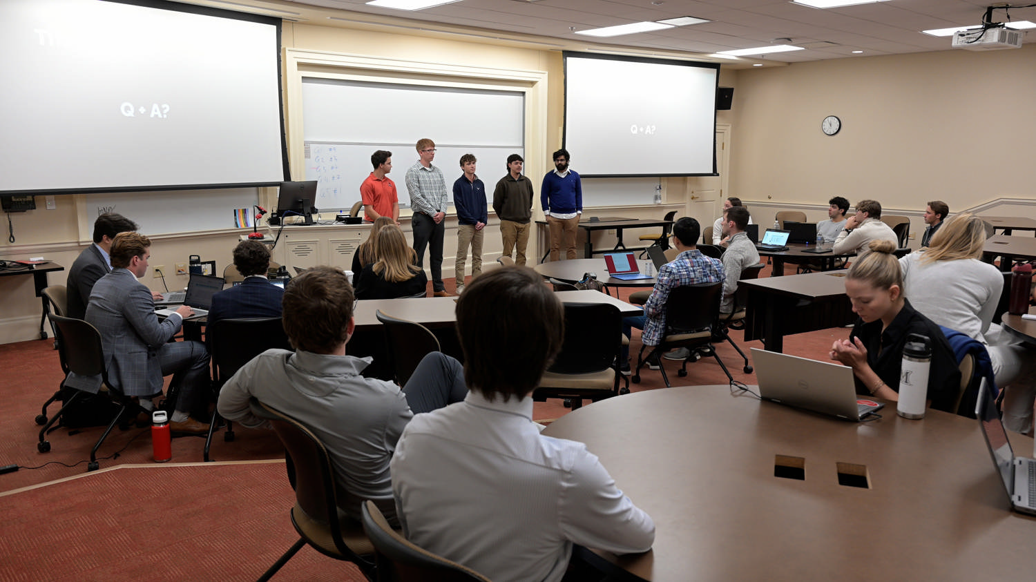A group of students presenting in front of their class