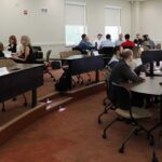 Faculty and AAG members gathered at round tables