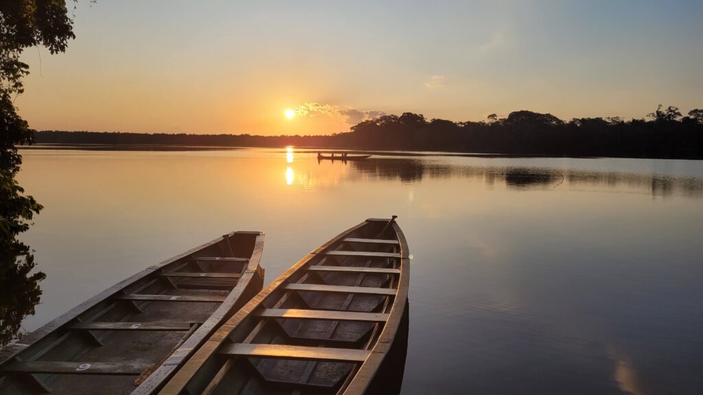 A beautiful sunset with two boats. 