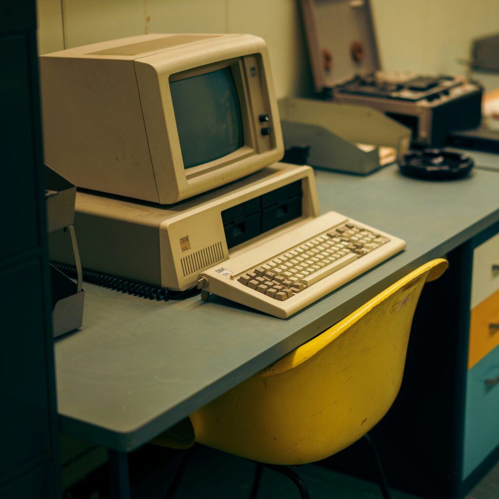 An old computer sitting on a desk.