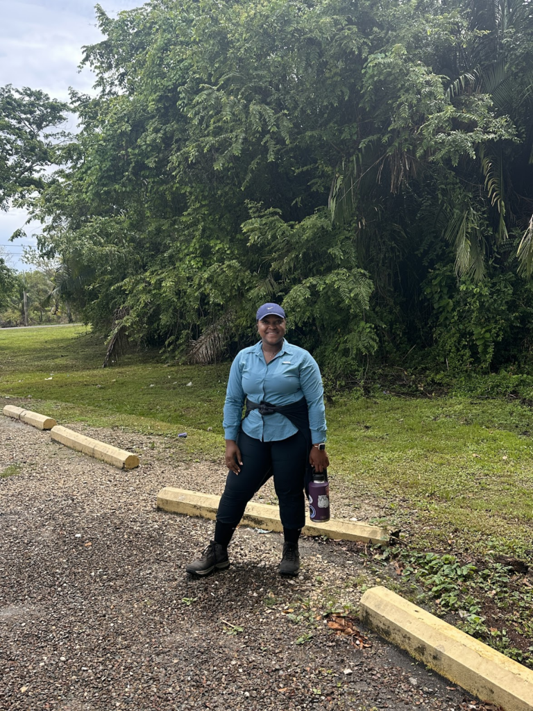 Pachancia Knowles stands by a wooded area.
