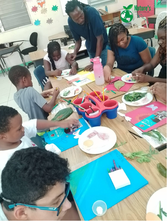 A diverse group of children and instructors working together at a table, engaging in arts and crafts.