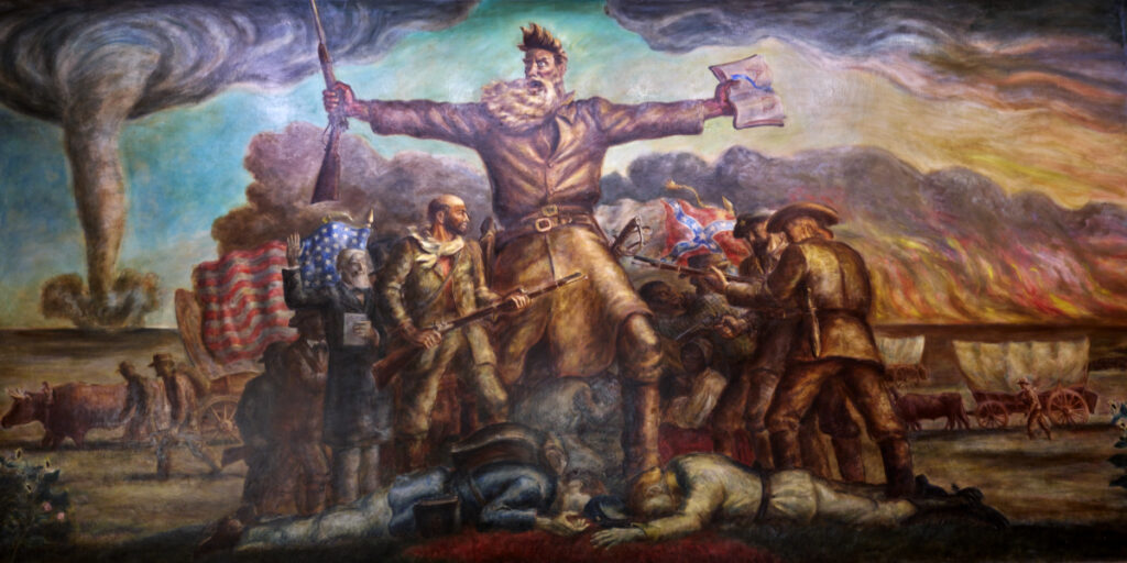 Mural with abolitionist John Brown at the center, holding a rifle and an open Bible. Behind him are scenes of civil war and settlers in covered wagons moving west, against a backdrop of fire and a whirlwind.