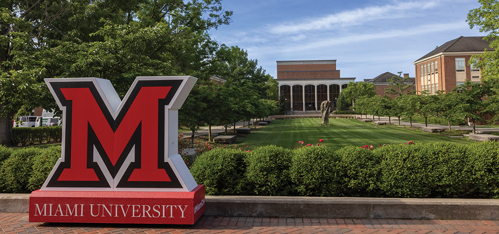 a large beveled-m sitting on campus