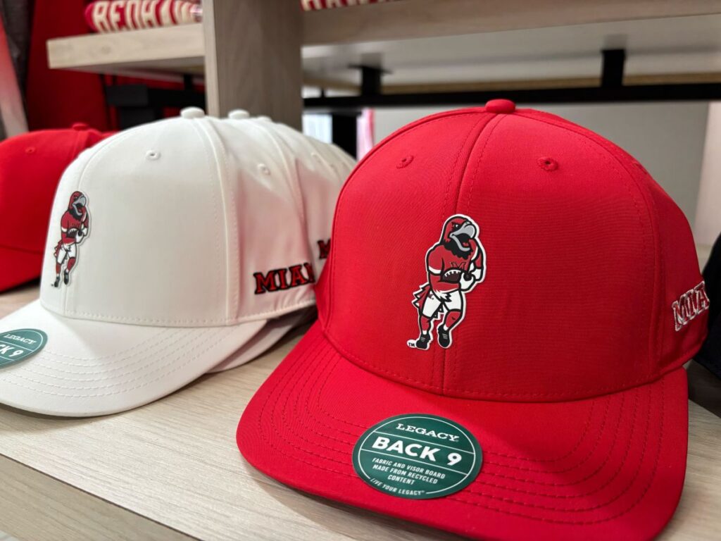 Baseball style hats with the football swoop illustration embroidered on them.