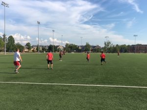 IT Services softball team playing defense in a recent game at Cook Field.