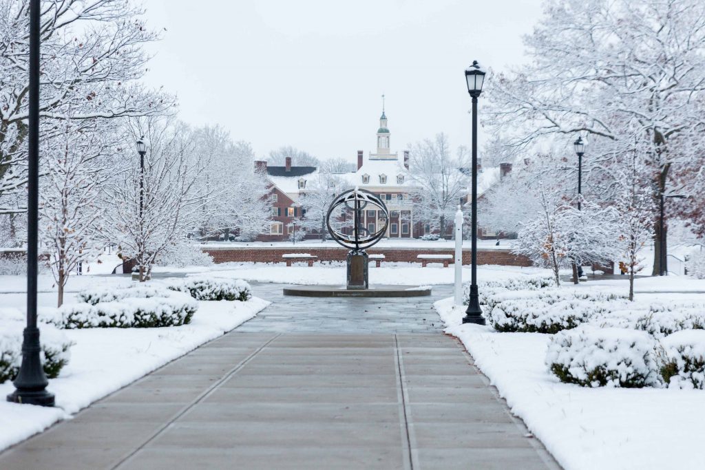 Snow on Miami's campus near the compass