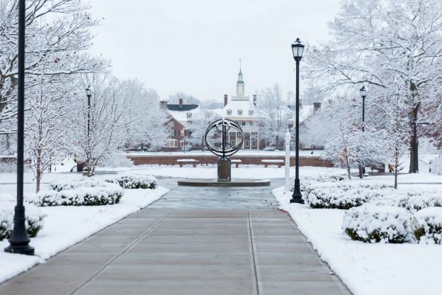 Snow on Miami's campus near the compass