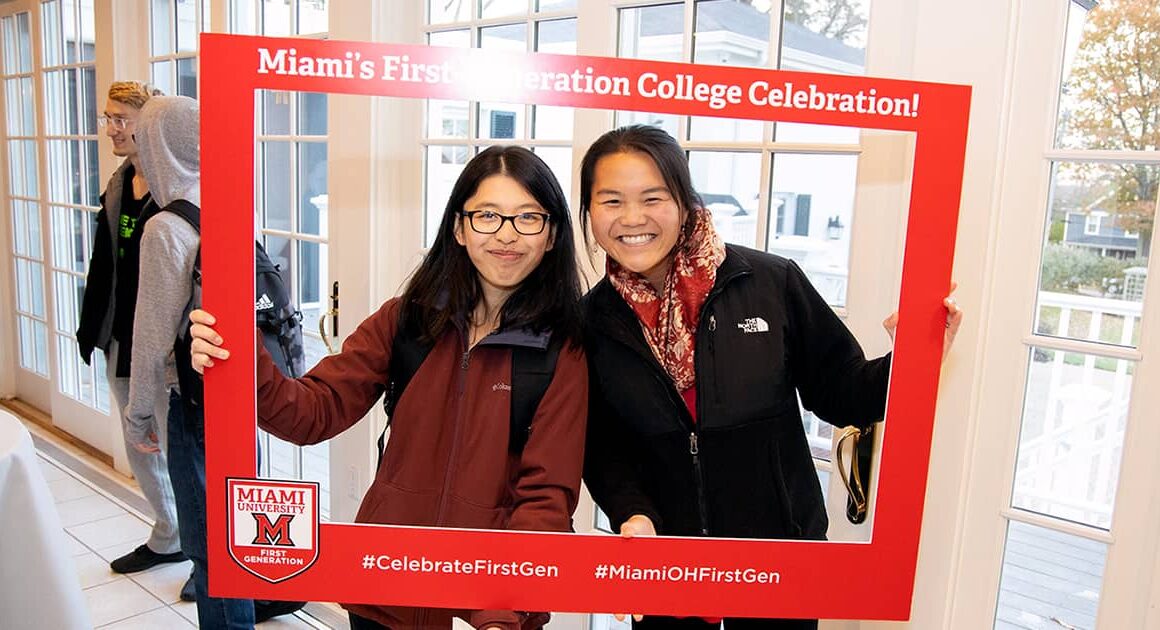 Two students smiling for a picture at a First Generation College Celebration event