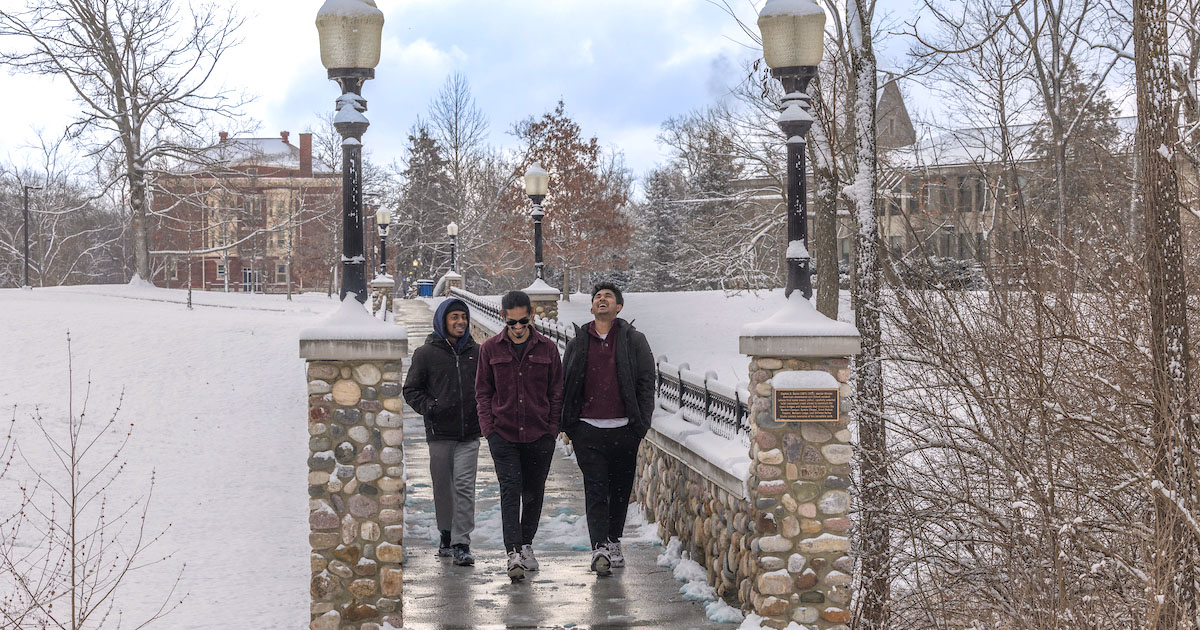 student walking outside in the winter talking and laughing