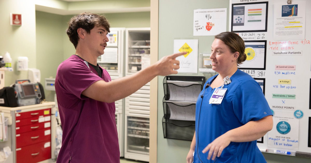 A Work+ student on the job with a nurse at Kettering Health