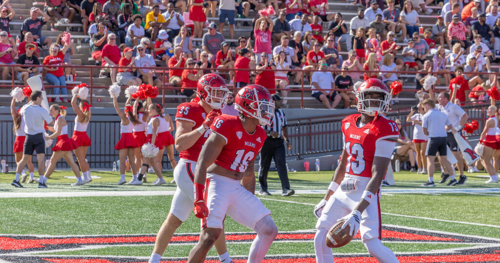 Miami University Redhawk football players and crowd