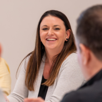 A woman leading a group conversation