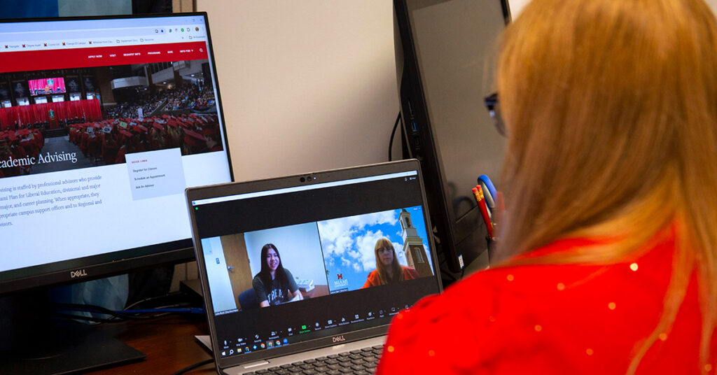 An academic advisor helping a Miami Online student via video conference
