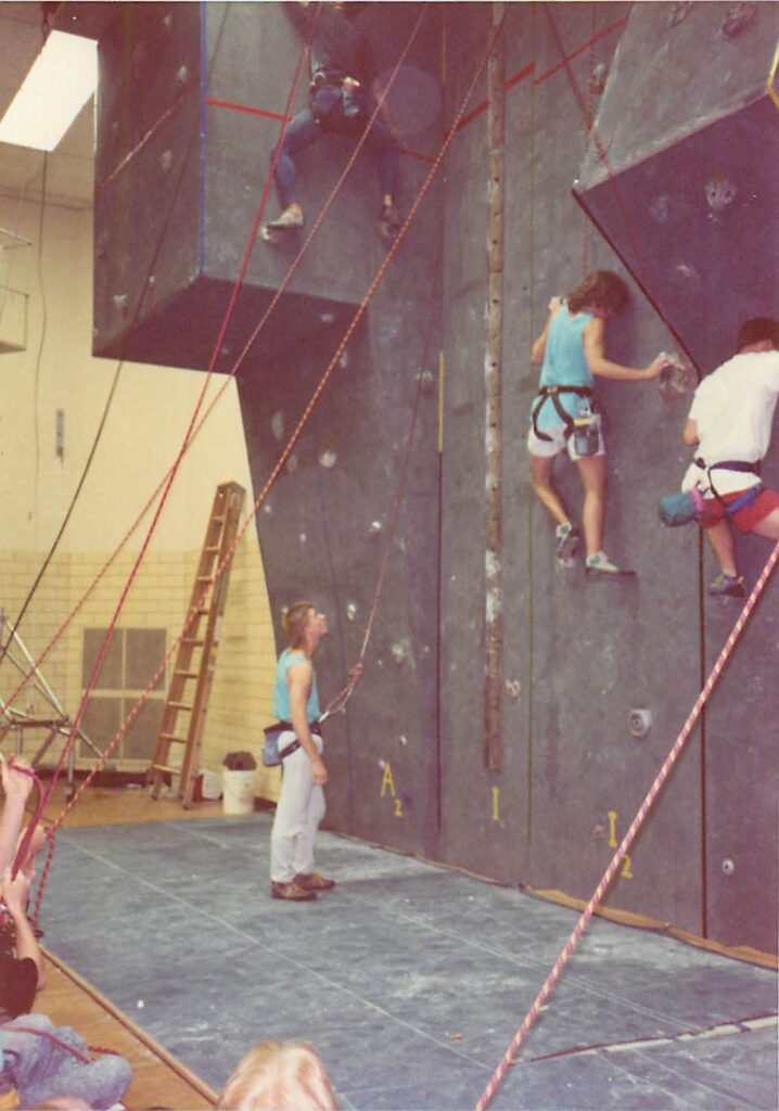 Climbing on the wall at Withrow Court during one of Miami’s first climbing competitions. (Photo courtesy of Andy Beerman)