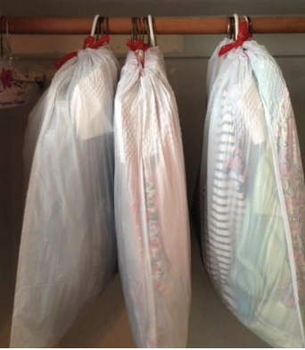 Clothes wrapped in trash bags
