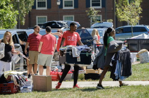 Students moving their personal belongings 